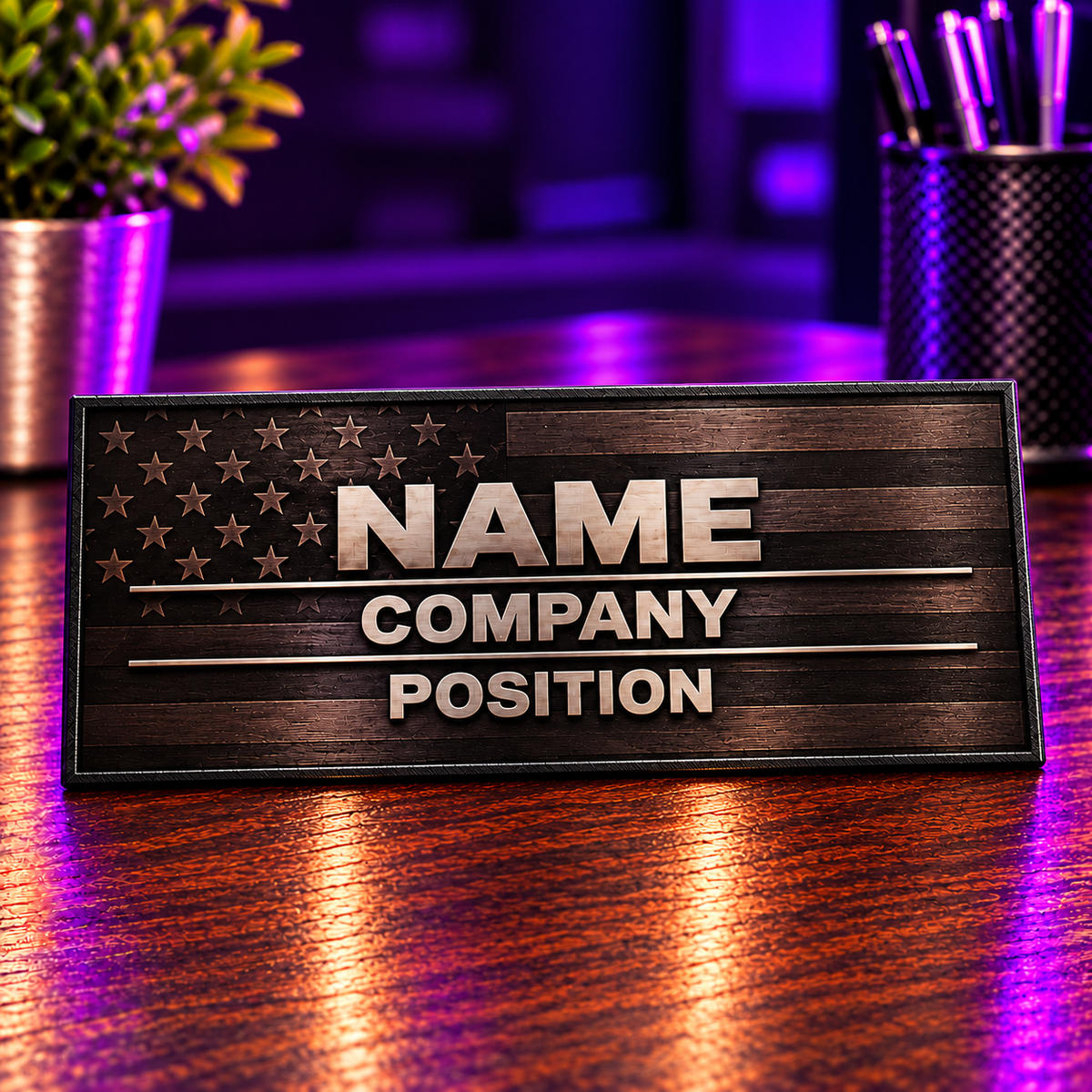 Custom American flag name plate with NAME, COMPANY, and POSITION on a purple-lit wooden desk