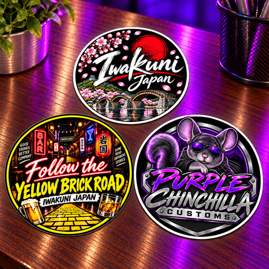 Three 2 inch round sticker designs on the purple-lit wooden desk, including a Purple Chinchilla Customs emblem